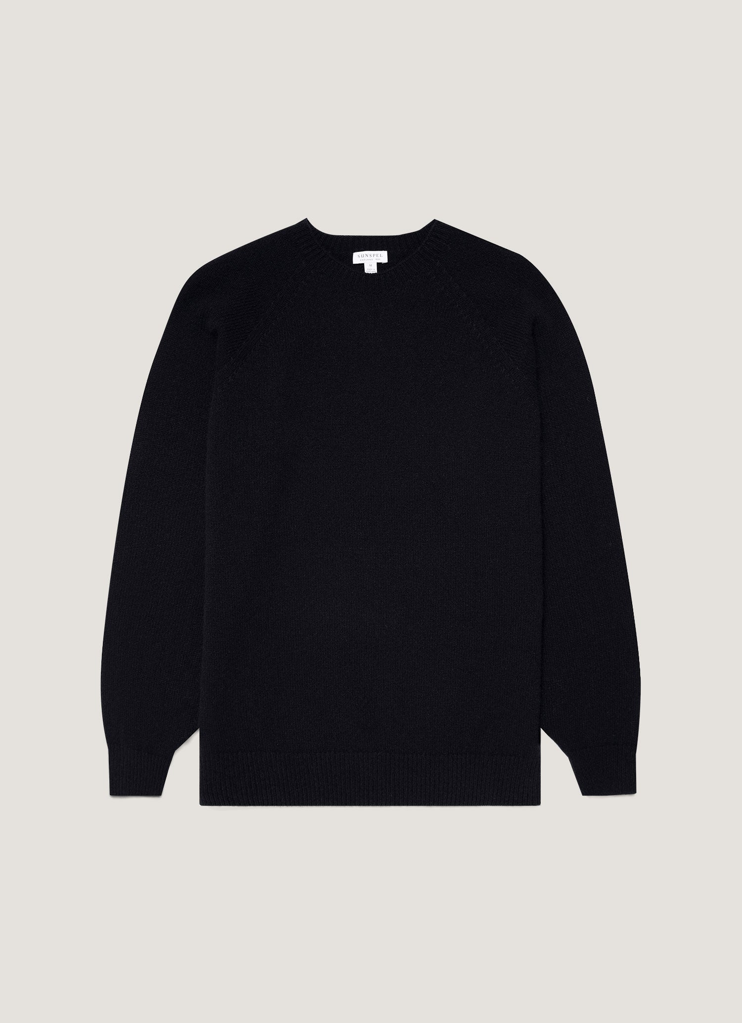 A dark navy mouline lambswool crew neck jumper.